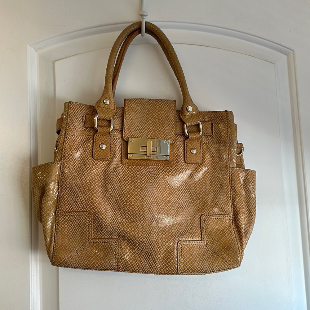 Calvin Klein snake skin Leather bag available in Tan color in good condition